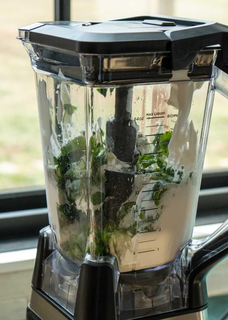 Sour cream, lime juice, chopped jalapenos, ranch seasoning, and cilantro in a blender