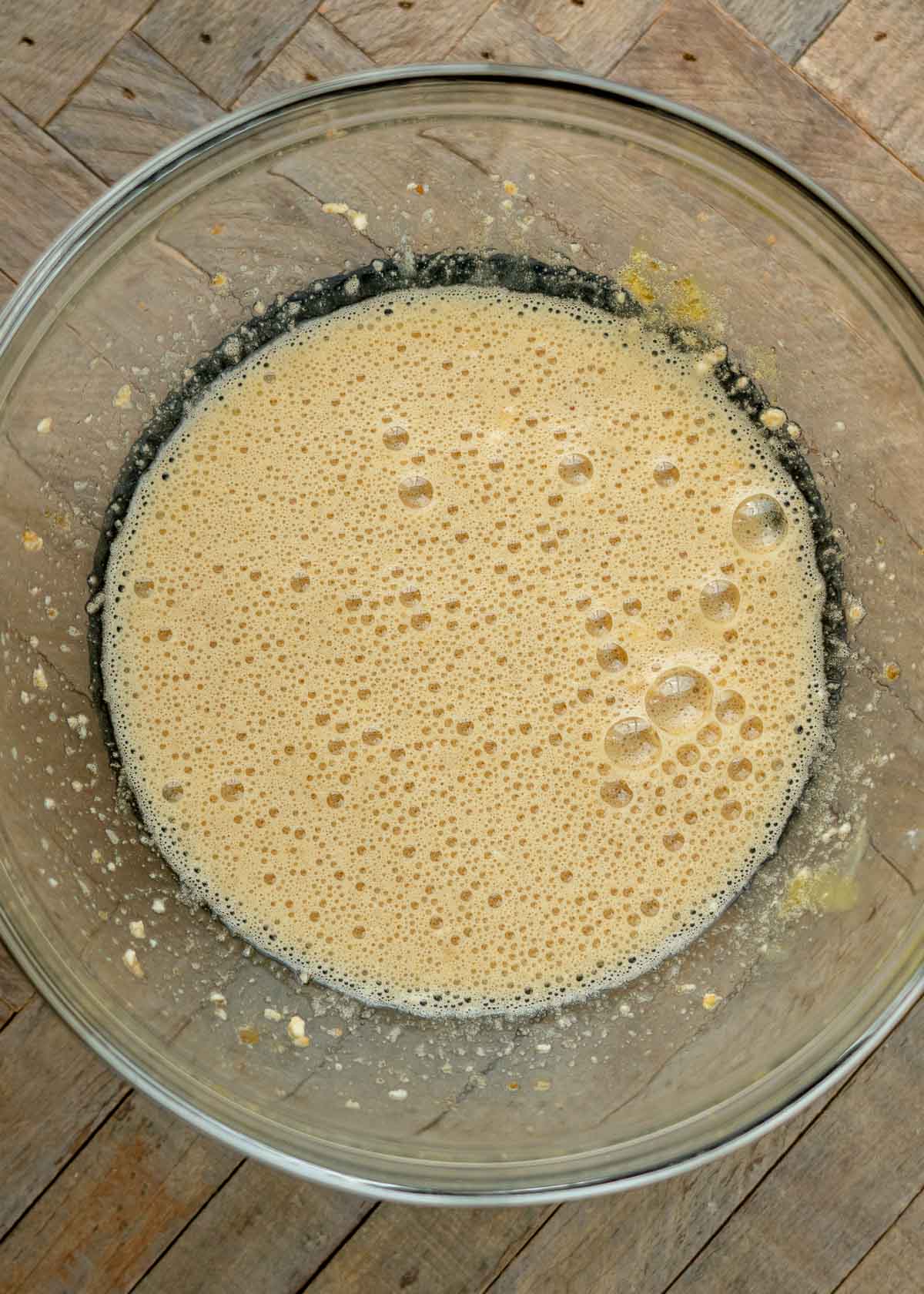 wet ingredients for coconut flour muffins mixed in a glass bowl