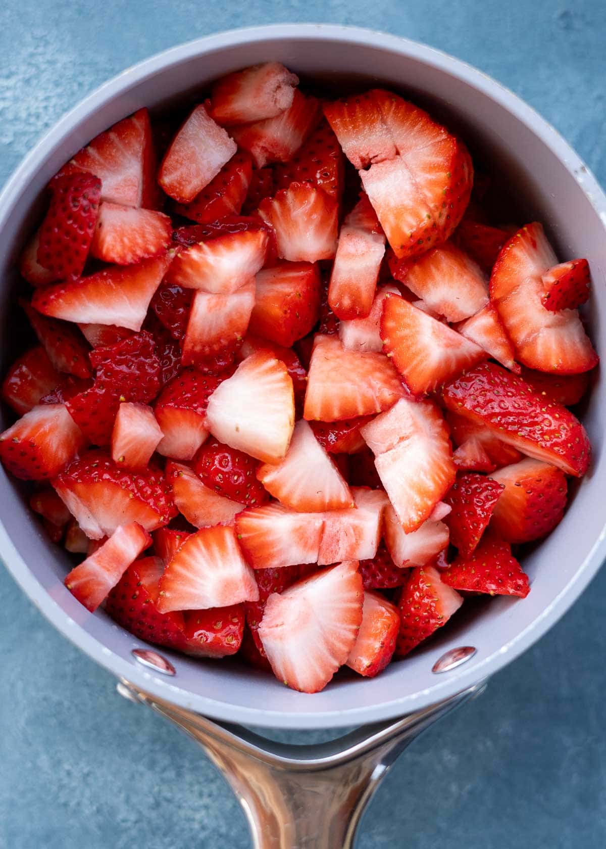 sliced strawberries in a saucepan